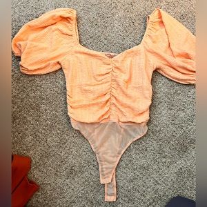 Peach short sleeve body suit